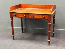 A Victorian mahogany washstand with three quarter gallery over two drawers on turned legs 87 x 107 x