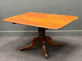 A 19th century mahogany breakfast table, the rounded rectangular tilt-top over a turned support with