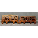 Two decorative Continental carved wood yokes, carved with pierced and incised decoration of