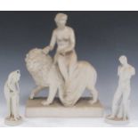 A Parian figure of Diana and the lion on a rectangular base 37cm high, together with a bathing venus