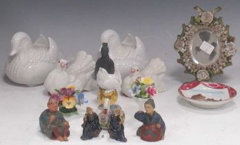Various china ornaments to include a pair of white bisque doves, a pair of blanc de chine mandarin