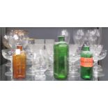 A collection of glassware including decanters, one with a silver collar, drinking glasses