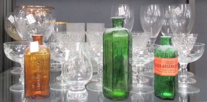 A collection of glassware including decanters, one with a silver collar, drinking glasses