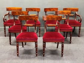 A set of eight Regency mahogany bar back dining chairs, with carved top rails over carved bar backs,