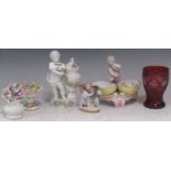 A Continental porcelain figural bonbon dish with Berlin sceptre mark, a putto with goat, a white
