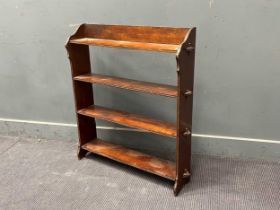An early 20th century open oak bookcase, with inset brass detail. 90 x 83 x 19cm