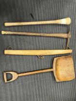 Four rustic tools to include a shovel, yoke, large pestle and an axe (4)