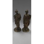 A pair of late 19th century bronze figures of female musicians in the classical style, with traces