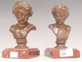 Pair of late 19th century small bronzed busts of a young child, set on porphory base. 16cm High (2)