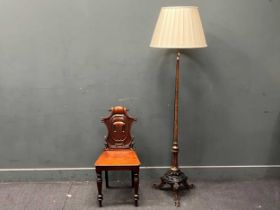 A Victorian hall chair and an early 20th century standard lamp with carved tripod base 177cm high