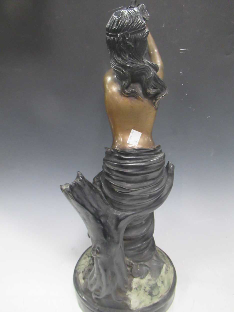 A modern bronze model of a draped young woman holding a dove, about 57cm high, and a bronzed - Image 4 of 6