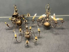 Three 18th century style six branch ceiling lights in brass, modern. The largest with dolphin motifs