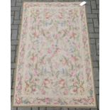 An English needlepoint floor covering with floral decoration 185 x 116 cm