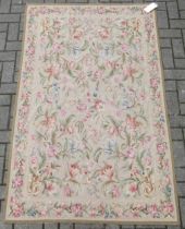 An English needlepoint floor covering with floral decoration 185 x 116 cm