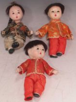 Three vintage Japanese composition painted dolls in costumes, 19cms High