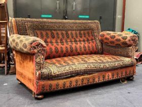 A three seater sofa drop end sofa, circa 1900, upholstered in a mohair printed fabric with paisley