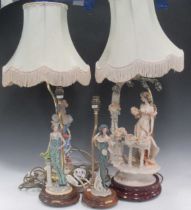 Two modern moulded figural table lamps, a Capo di Monte table lamp with wooden base and another