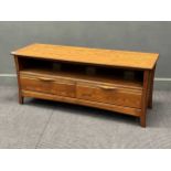 An Ercol stained elm sideboard 55 x 133 x 44cm