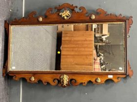 A George II style mahogany and parcel gilt shaped rectangular wall mirror, 83 x 127cm
