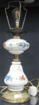 A Victorian painted white opaline table lamp 50cm high