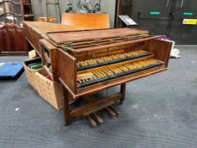 A double manual harpsichord made by Alec Hodson c1939. Set on stand with mahogany case cross