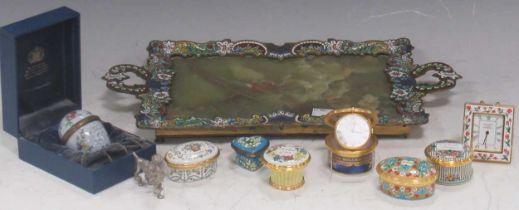 An onyx and enamelled border tray, with Halcyon Days and similar enamel boxes and a miniature clock,