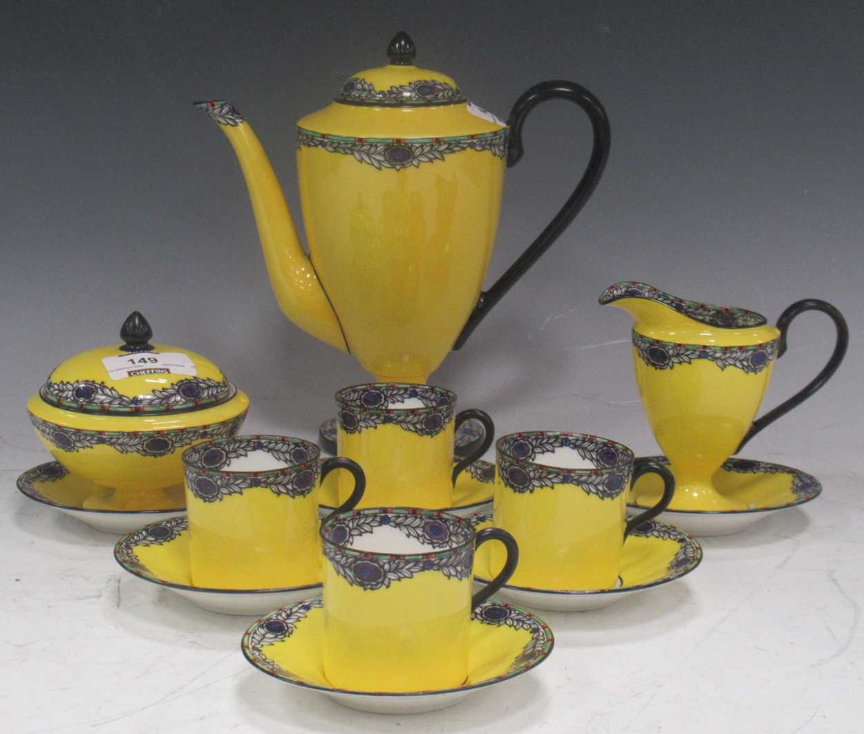 Circa 1900 coffee set, the bright yellow ground decorated with a rim of swagged stylised floral