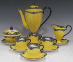 Circa 1900 coffee set, the bright yellow ground decorated with a rim of swagged stylised floral