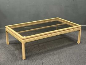 A modern rectangular cream painted and parcel gilt coffee table, with black glass inset top 44 x