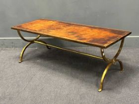 A Regency style brass and leather x-framed coffee table. 45cm x 122cm x 51cm