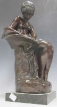A modern bronze model of a draped young woman holding a dove, about 57cm high, and a bronzed