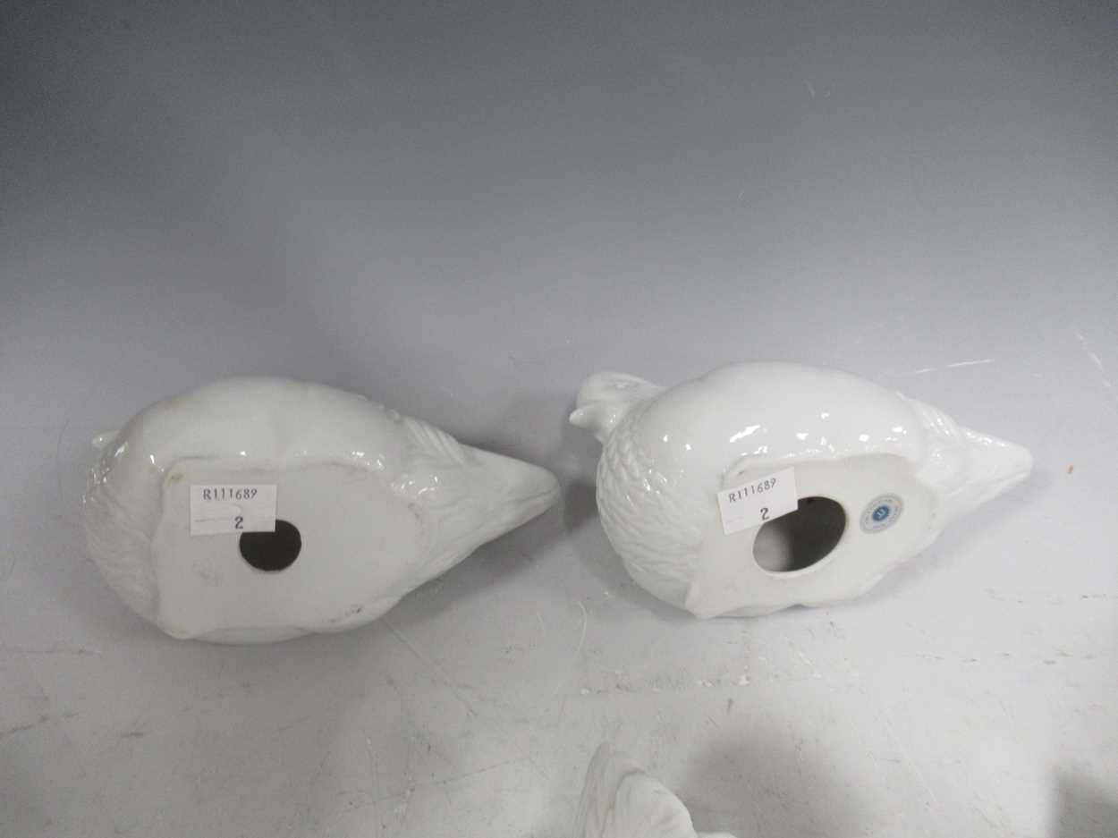 Various china ornaments to include a pair of white bisque doves, a pair of blanc de chine mandarin - Image 10 of 13