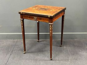 An Edwardian rosewood and inlaid envelope card table, on tapering legs with castors 75 x 56 x 56cm