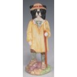 A Beswick sheepdog, holding crook dressed in sunshine yellow smock and jaunty hat. 14cm High