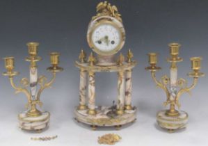 A French marble and gilt metal clock garniture on pillar supports, late 19th century, including a
