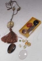 A moulded glass 'bug' pendant strung with two smaller bugs; with a collection of agates and facetted