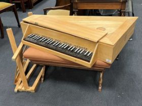 A modern straight sided spinet on stand, made by John Storrs of Chichester circa 1980, in a pale oak