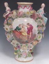 A 19th century Continental style decorative vase with high relief applied floral decoration