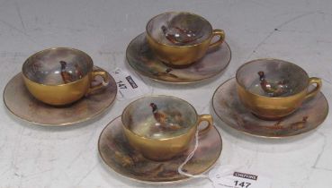 Set of four Royal Worcester miniature cabinet tea cups and saucers painted by James Stinton for