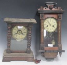Two small continental century wall clocks with turned and carved details Junghans. One 41cm High,