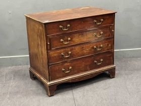 A George III mahogany dressing table chest, the fitted top drawer with hinged mirror over three long