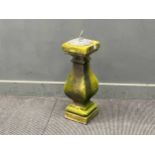 A Victorian hand carved stone stepped baluster surmounted by an associated octagonal lead sun dial