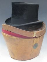 A top hat by Lincoln Benett & Co London, in worn leather box 21cm x 17cms inside measurement inner