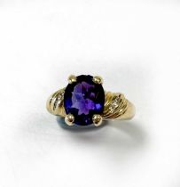 An amethyst and diamond ring stamped '585 14K', weight 4.8g