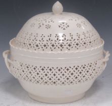 A late 19th century Leedsware pierced creamware tureen and cover with artichoke finial. 25cm High