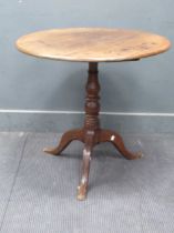 A late Georgian country-made mahogany and oak circular top tripod occasional table, (restorations)