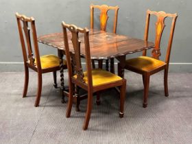Four Edwardian inlaid mahogany dining chairs together with an oak gateleg dining table with