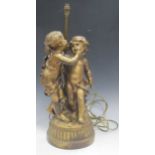 A large gilt metal figure group of two young children after Moreau, fitted as a lamp base, 64cm