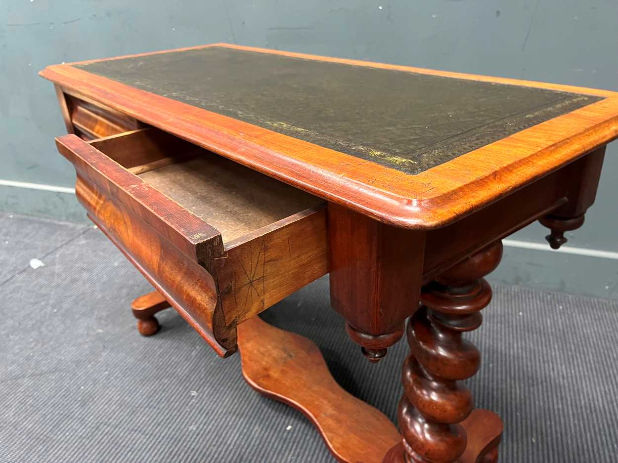 A late Victorian mahogany writing table with tooled leather top on barley twist supports 70cm x - Image 2 of 3