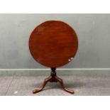 A George III mahogany tripod table circular tilt-top over a turned support on cabriole legs 71 x